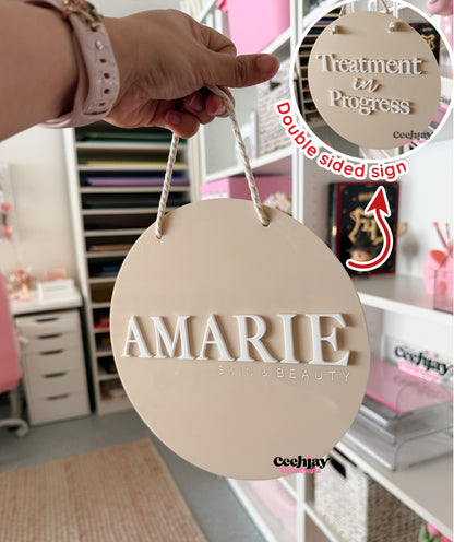 Double sided hanging round sign